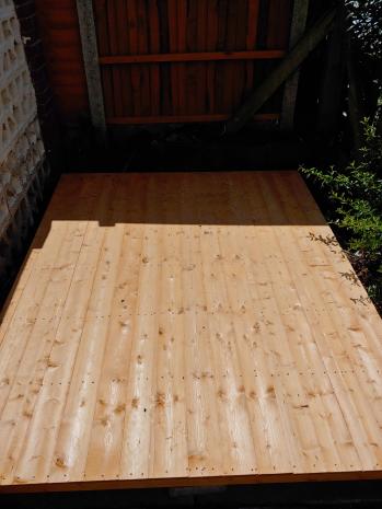 A shed base laying on the floor